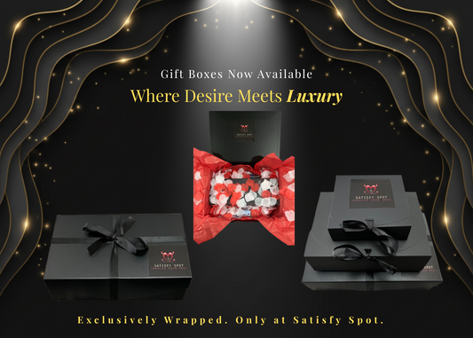 Gift boxes with red ribbon and black packaging on a dark background with decorative elements.